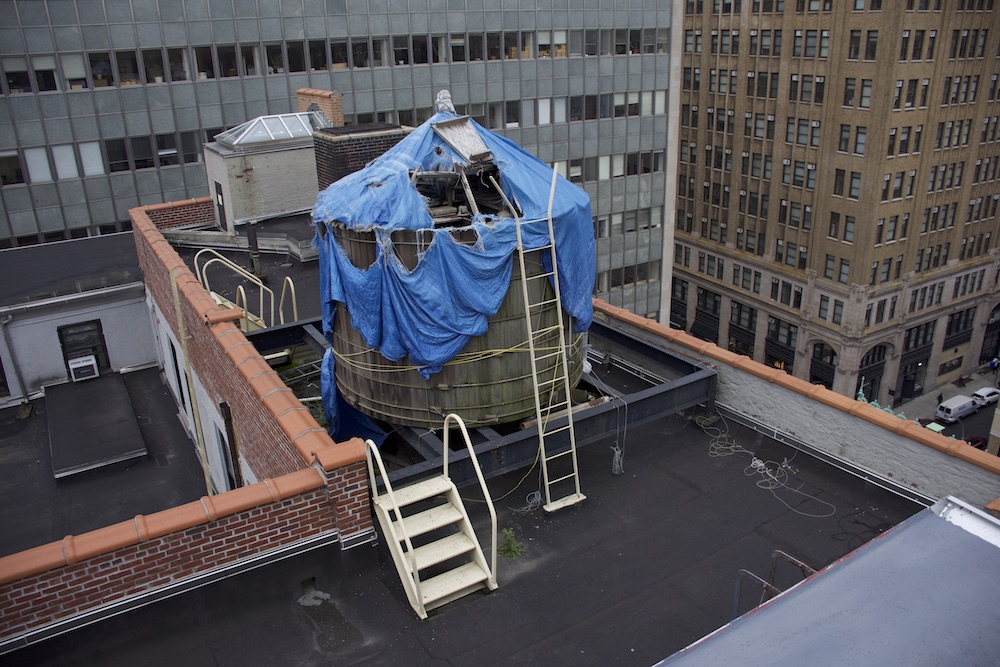 The drinking water supply for offices of the New York City Department of Sanitation doesn’t even have a roof – just a tattered tarp.